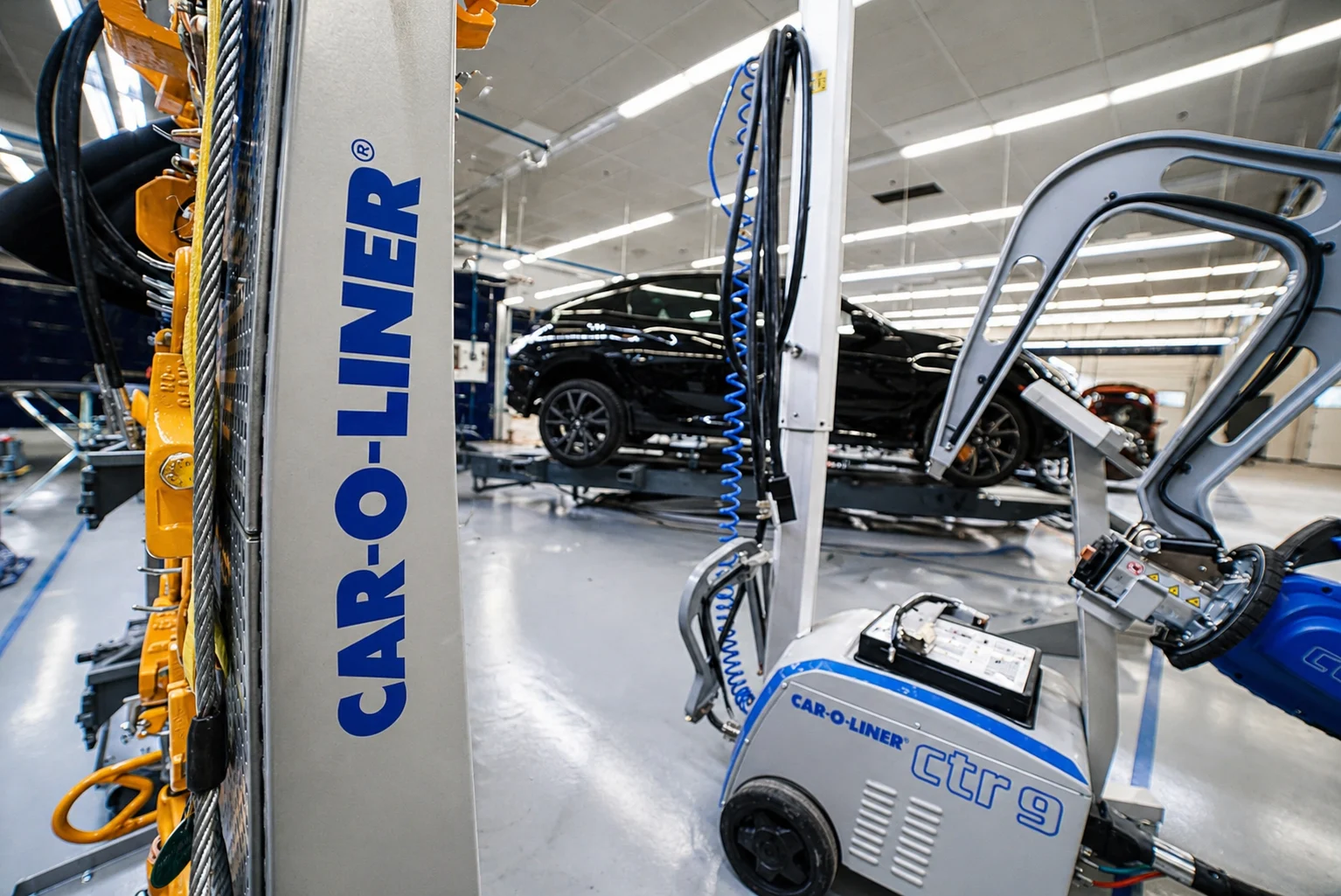 Vehicle mounted on Car-O-Liner frame machine with structural alignment equipment in use